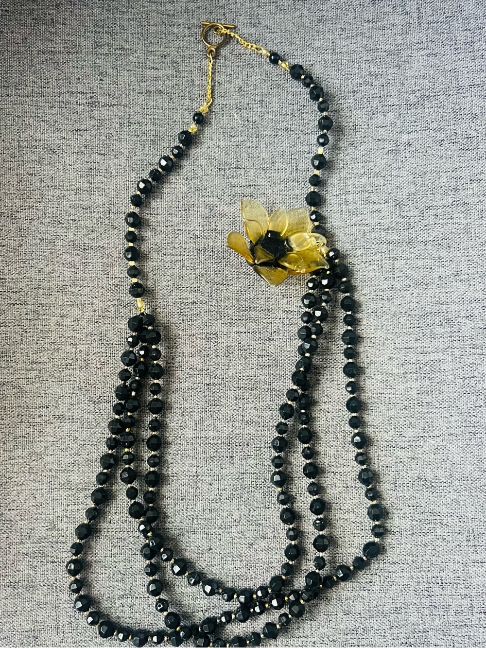Handmade Black Beaded Multi-Strand Necklace with Gold Flower Accent